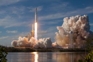 gray spacecraft taking off during daytime by SpaceX courtesy of Unsplash.
