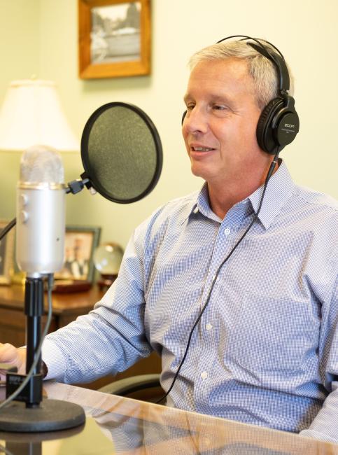 Tom Hamilton recording a Wall Street to Main Street Episode
