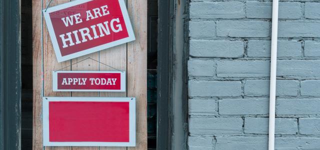 a sign that says we are hiring and apply today by Eric Prouzet courtesy of Unsplash.